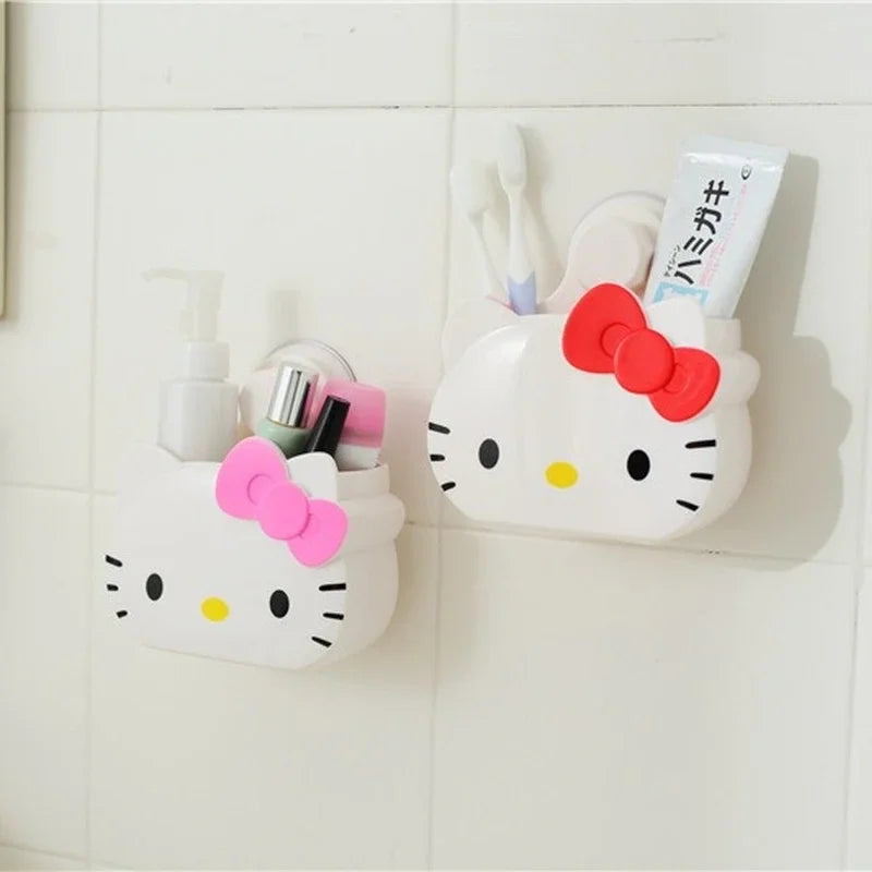 Cartoon bathroom organizer wall mount with Hello Kitty design holding toiletries on white tiled wall