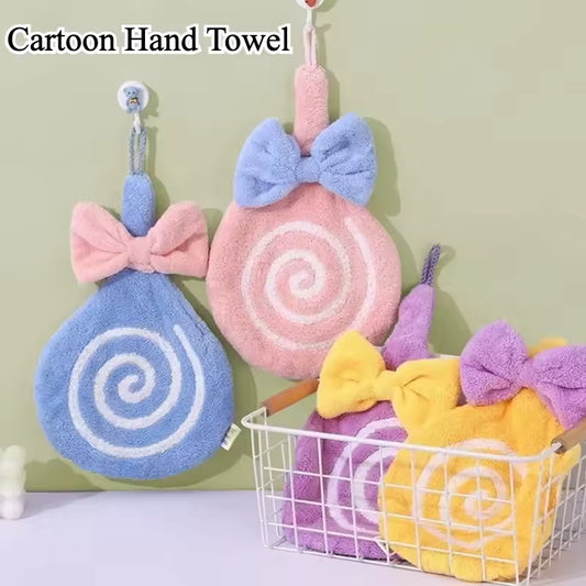Colorful lollipop design bathroom towel set with bows in pastel pink, blue, purple, and yellow hanging and in a basket