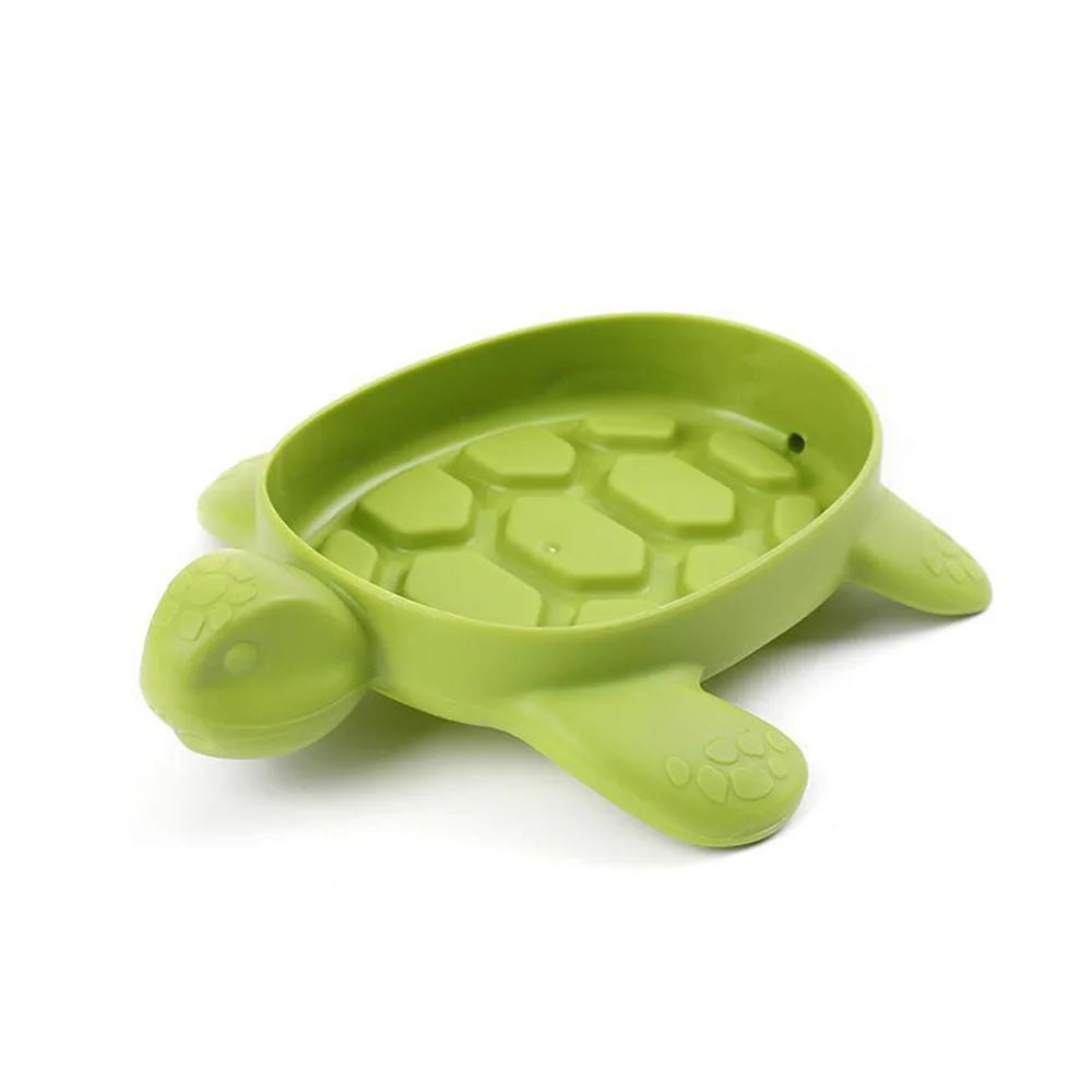 Green cartoon turtle soap holder with textured shell design for bathroom organization