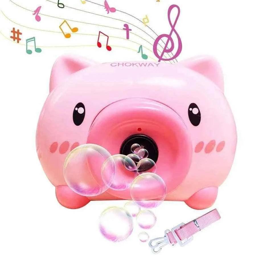 Pink pig-shaped children's bubble machine toy blowing bubbles with musical notes and wrist strap