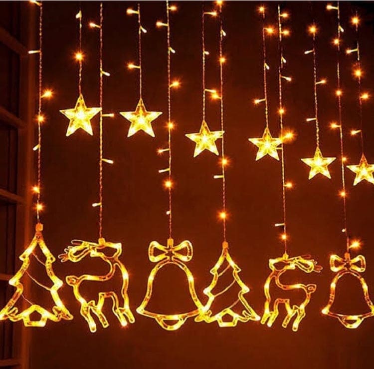 Christmas star fairy lights with glowing stars, reindeer, Christmas trees, and bells decoration