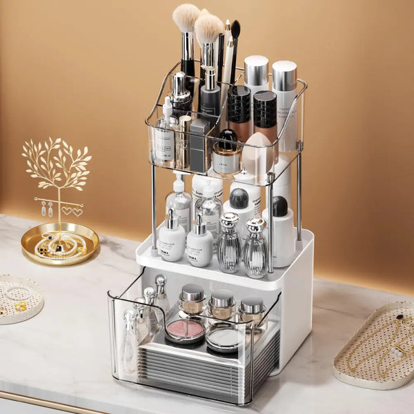 2-tier acrylic makeup organizer with clear tiers and drawer holding brushes foundations and skincare bottles