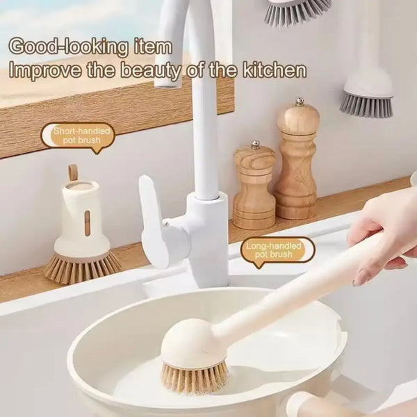 White long handle kitchen pot brush scrubbing a white saucepan with round stiff bristles for easy cleaning