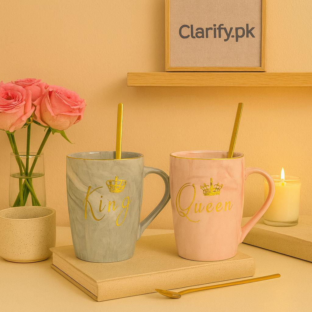 Clarify.pk couple ceramic mugs with King and Queen gold lettering and matching gold spoons on beige background