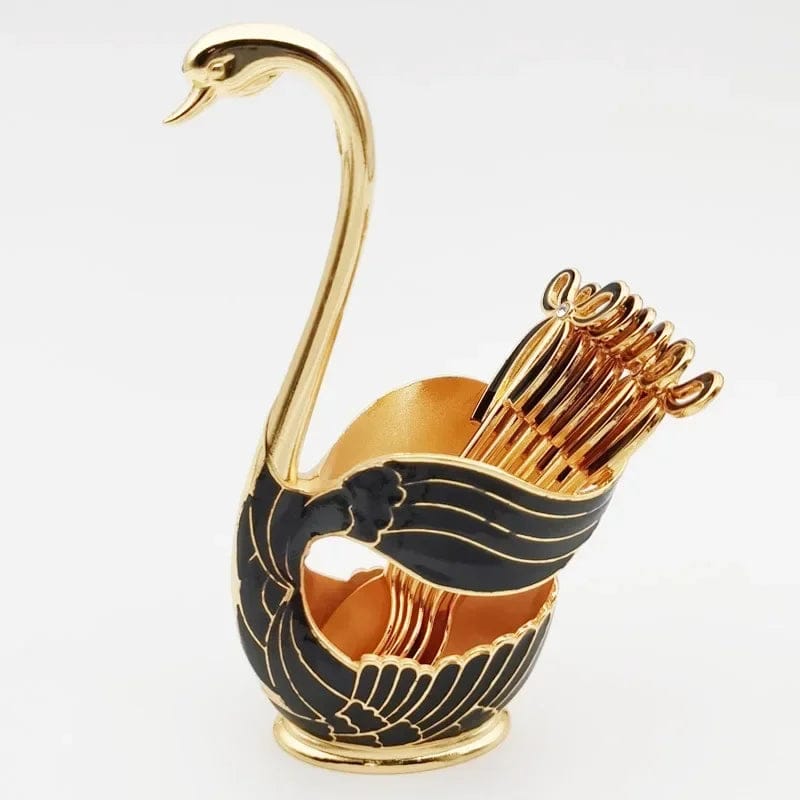 Elegant gold and black swan figurine home decor holding gold utensils for stylish table display