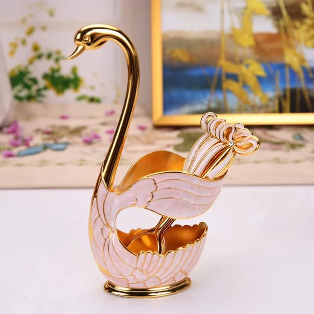 Elegant swan figurine home decor in gold and white with detailed wings and curved neck