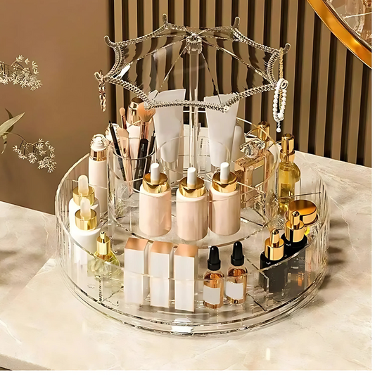 Clear acrylic 360 rotating makeup organizer holding skincare bottles and makeup tools on a vanity