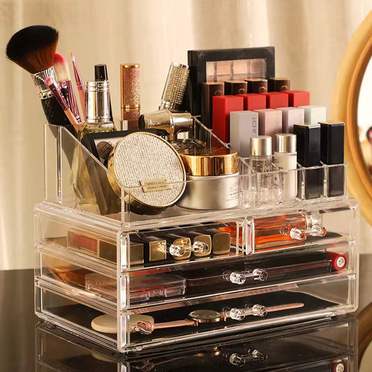 Clear makeup organizer with drawers holding brushes lipsticks perfume and cosmetic items