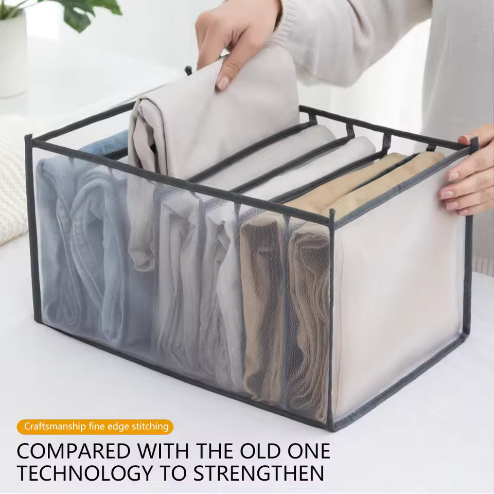 Closet organizer for clothes with fine edge stitching holding neatly folded clothes in mesh compartments