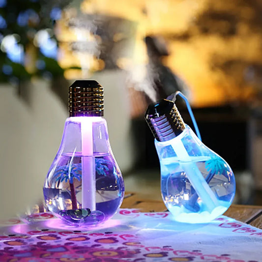 Clarify.pk colorful bulb humidifier with glowing purple and blue light releasing mist on table