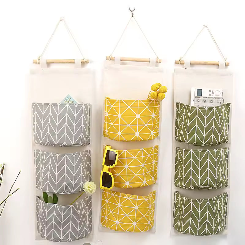 Clarify.pk hanging wall storage organizer with multiple fabric pockets in gray yellow and green for home organization