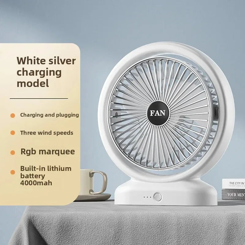 White silver colorful LED desk fan with three wind speeds and built-in lithium battery on gray surface