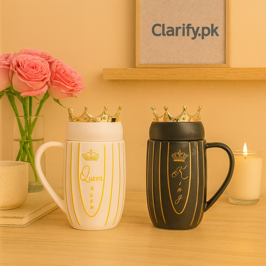 Couple mugs with crowns design featuring a white Queen mug and a black King mug on a wooden table