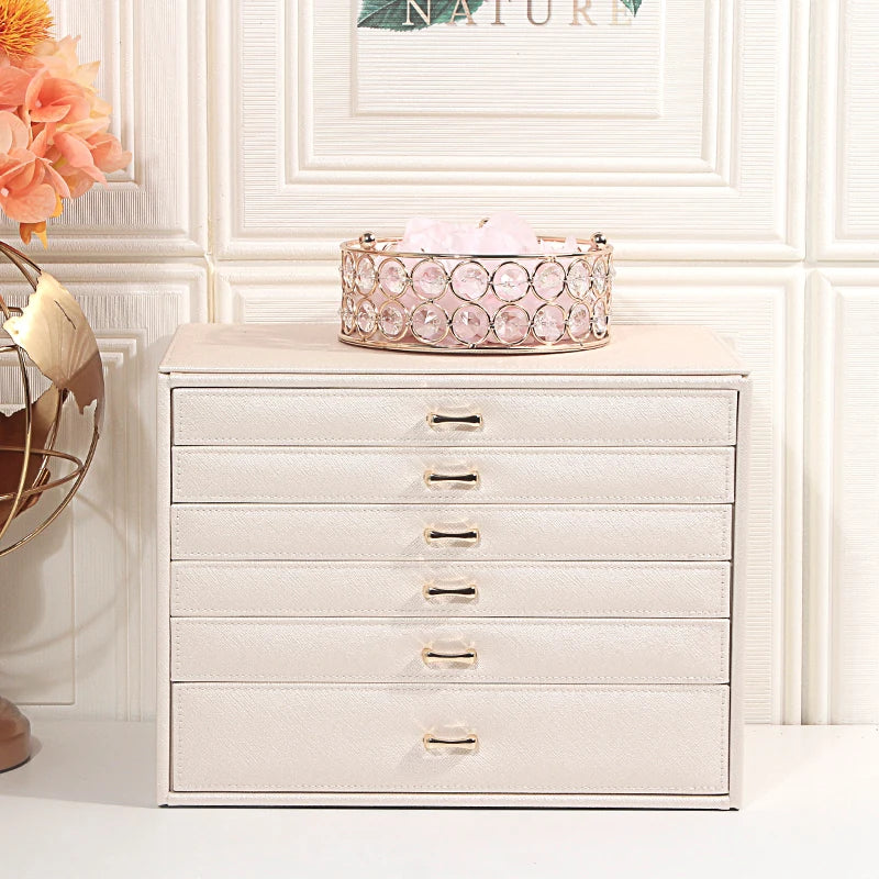 Clarify.pk white 5 layer fashion jewelry storage box with gold handles on a white surface