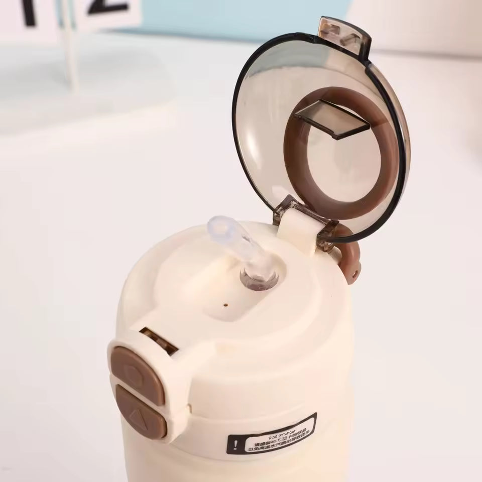 White stainless steel sports water bottle lid with flip-top and silicone straw for easy drinking