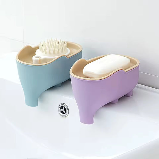 Creative animal soap holder for bathroom in blue and purple colors placed on a white sink
