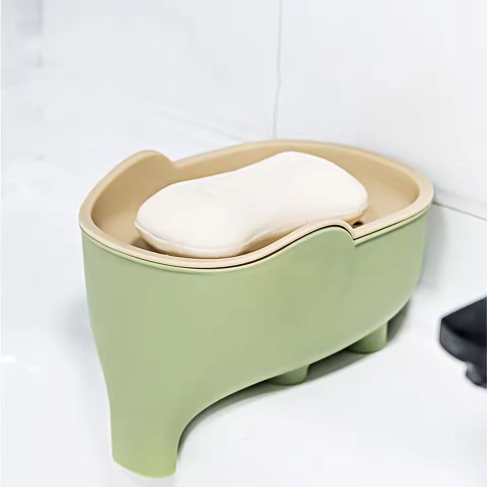 Creative animal soap holder for bathroom in green and beige with a white soap bar on top