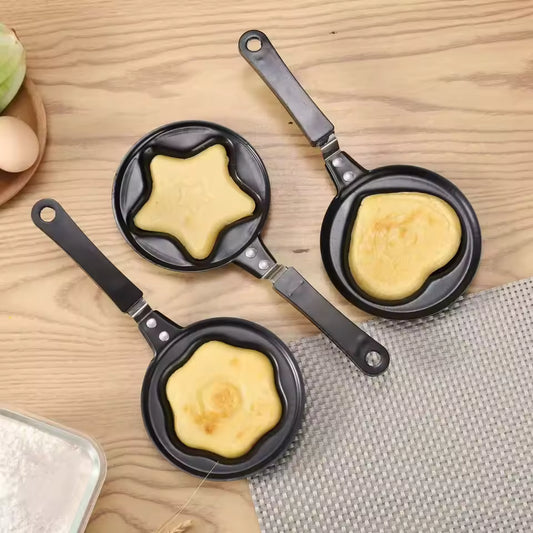 Creative cartoon mini omelette pan set with star, heart, and flower shapes cooking eggs