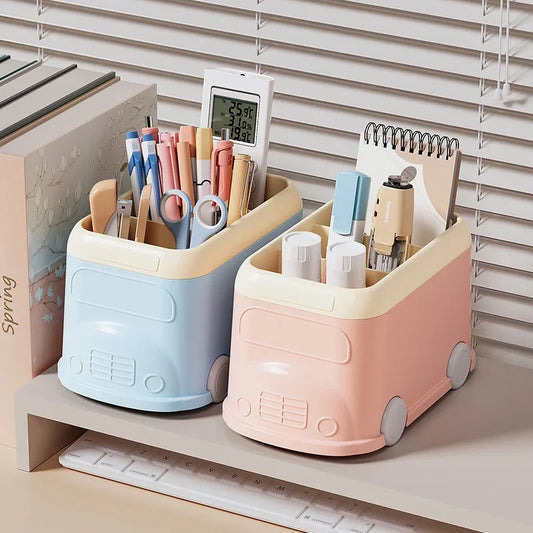 Clarify.pk creative desktop pen holder in blue and pink shaped like mini buses holding pens and stationery