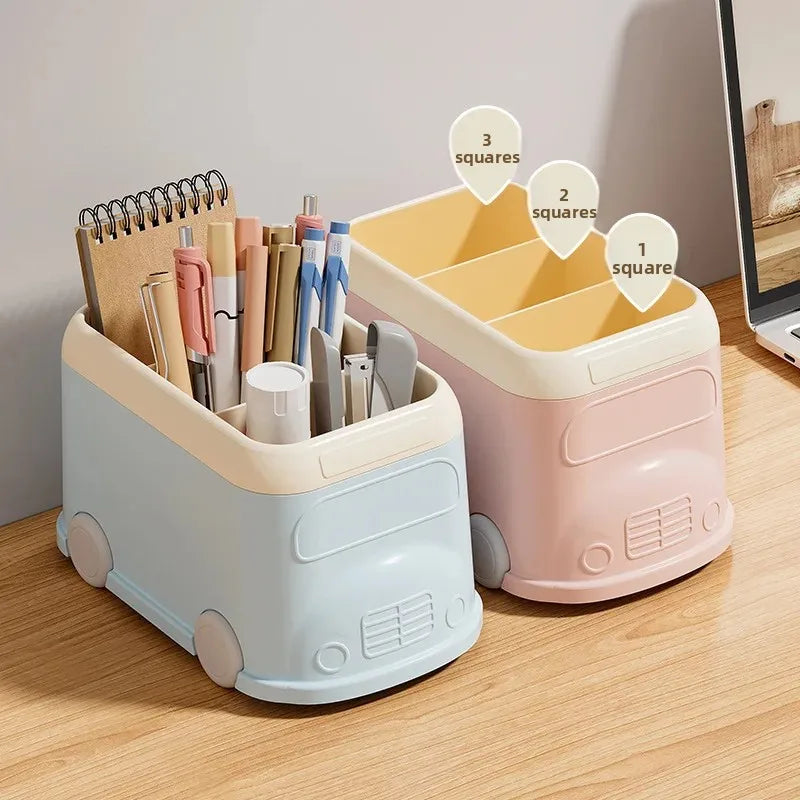 Creative desktop pen holder in pastel blue and pink designed like small trucks with compartments