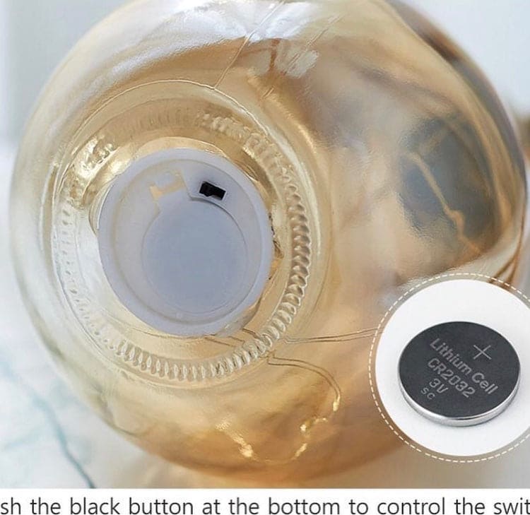 Bottom view of creative hemp rope LED bulb showing battery compartment with lithium cell battery