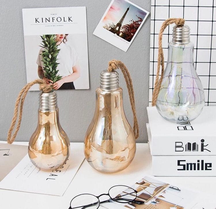 Set of creative hemp rope LED bulb decorative lights with glass bulbs on a white desk