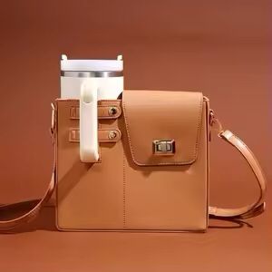 Clarify.pk tan leather crossbody water bottle carrier bag with front pocket and adjustable strap