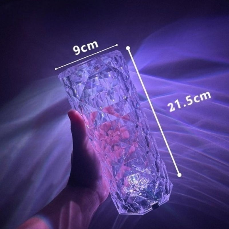 Crystal lamp with bluetooth speaker glowing purple held in hand showing 9cm width and 21.5cm height dimensions