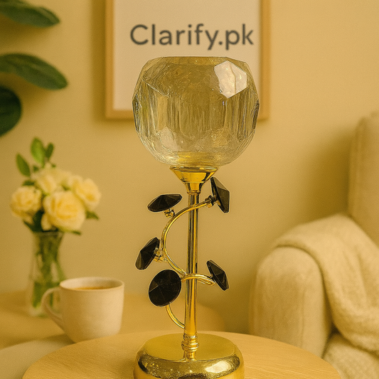 Elegant crystal leaf goblet candle holder with gold stem and black leaves on wooden table
