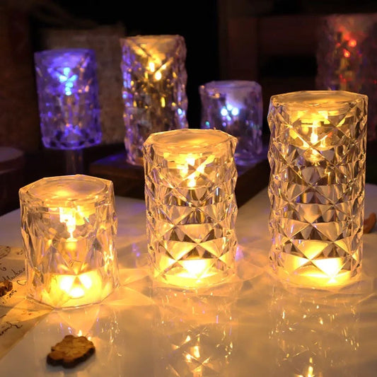 Crystal rose Crystal lamp set with warm glowing lights on a reflective surface