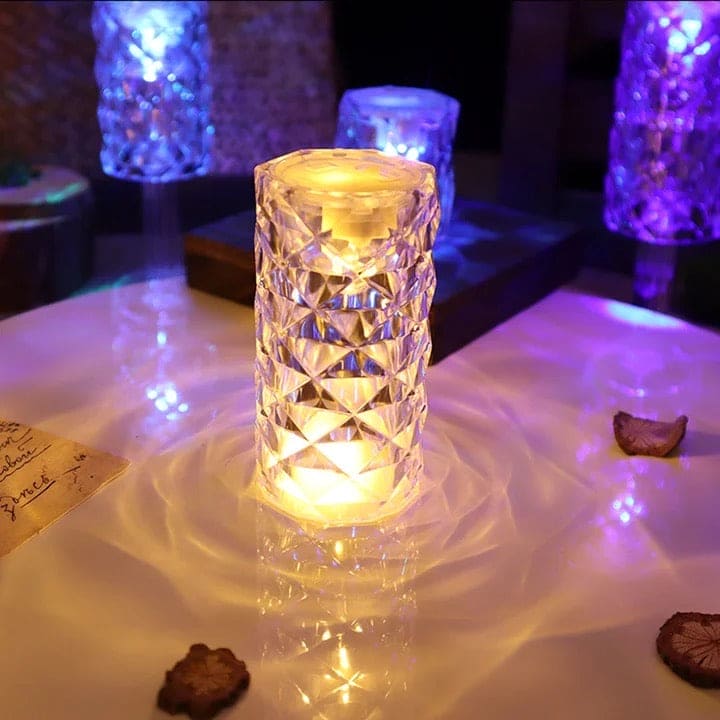 Elegant crystal rose Crystal lamp glowing warmly on a surface with reflective light patterns