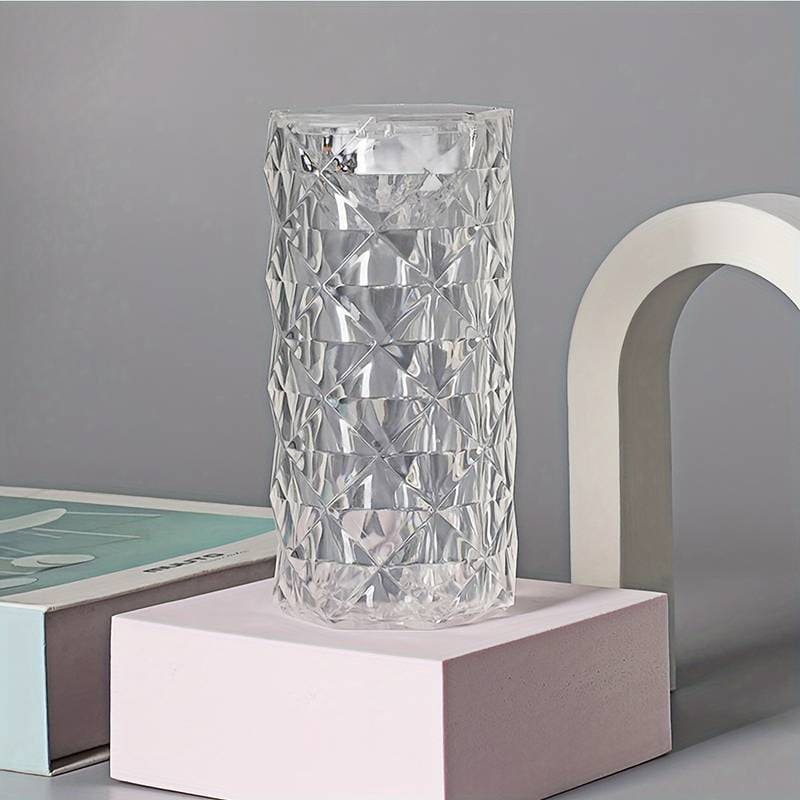 Crystal rose Crystal lamp with clear geometric pattern on a pink and gray decorative stand