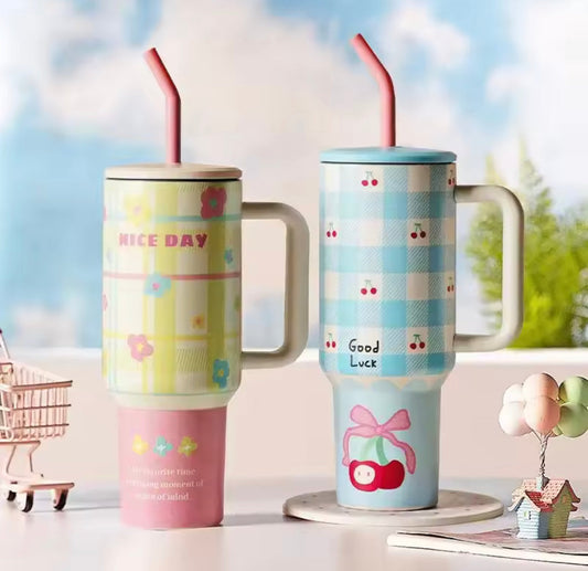 Two colorful 1200ml stainless steel tumblers with handles and straws featuring floral and cherry patterns