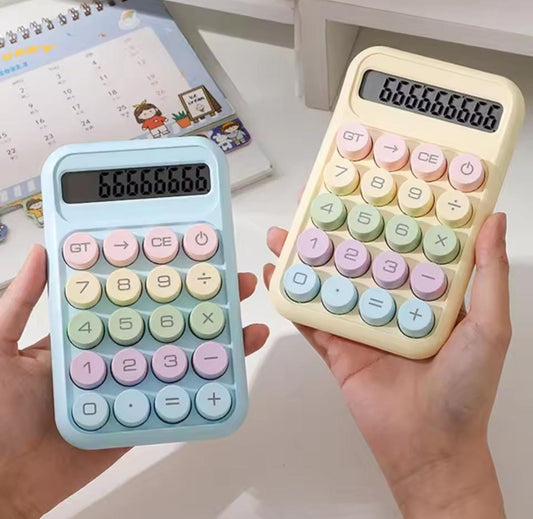 Cute calculator for students in pastel colors with large buttons held in hands from Clarify.pk