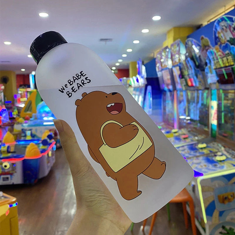 Cute Cartoon Drinkware water bottle with We Bare Bears bear design held in hand in arcade setting