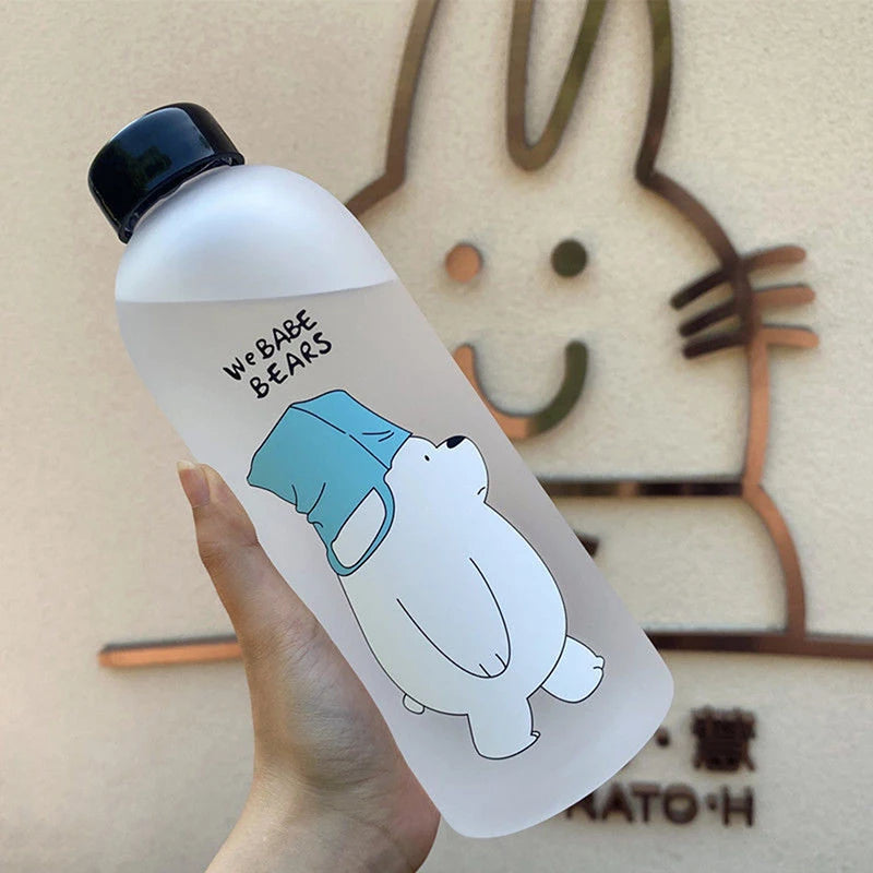 Clear water bottle featuring cute cartoon drinkware design of a white bear wearing a blue cap