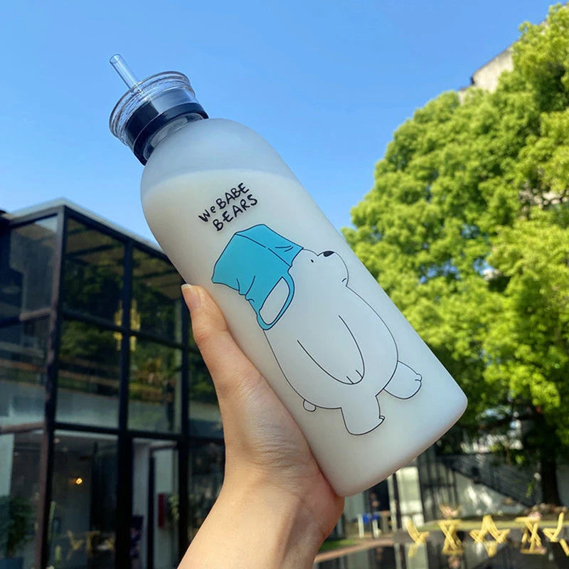 Clear bottle with cartoon bear design and straw featuring cute cartoon drinkware style