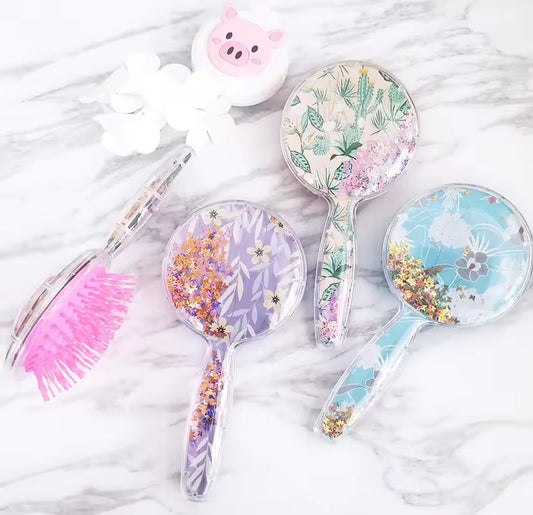 Cute children hair brush set with floral designs and pink bristles from Clarify.pk on marble background