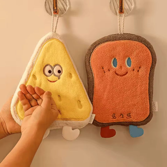 Cute coral velvet hand towels shaped like smiling toast and sandwich hanging on hooks for hand wiping