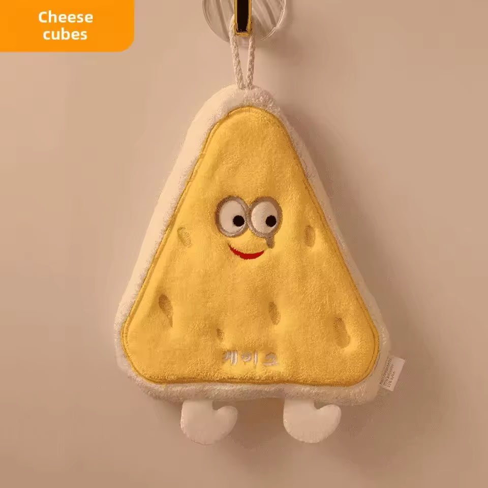 Cute coral velvet hand towels by Clarify.pk shaped like a smiling yellow cheese cube with eyes