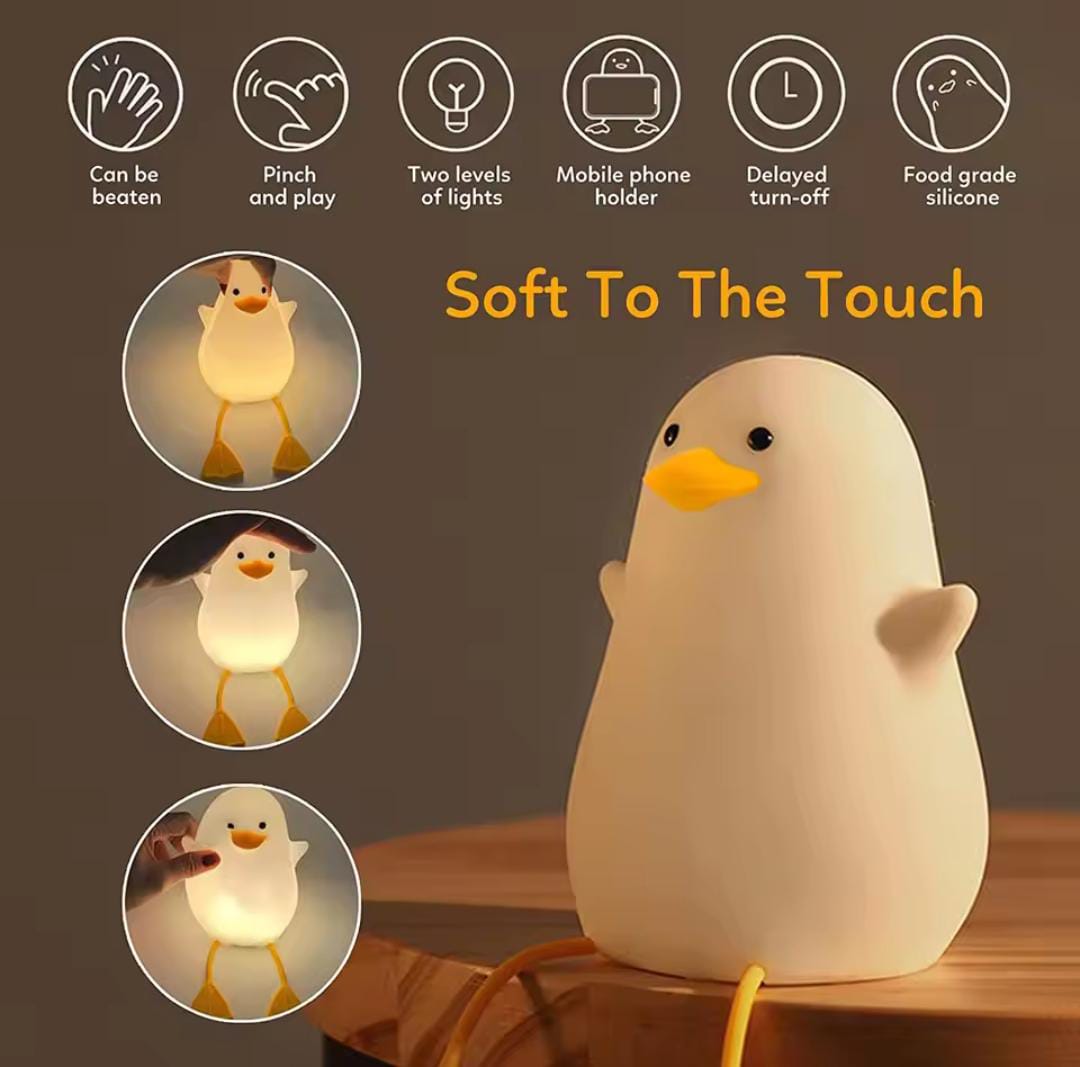 Cute duck night lamp soft to the touch with two light levels and mobile phone holder feature