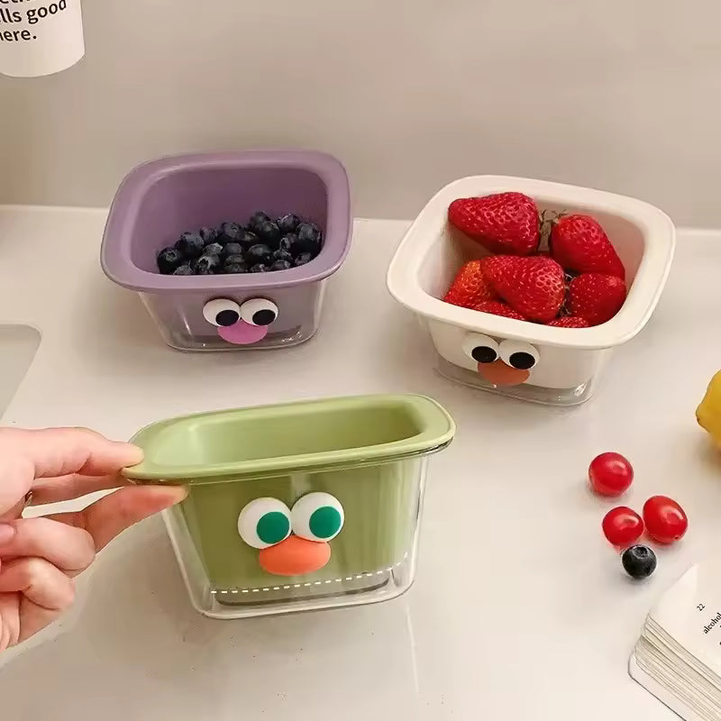 Clarify.pk cute fruit drain basket set in purple, white, and green with googly eyes holding strawberries and blueberries
