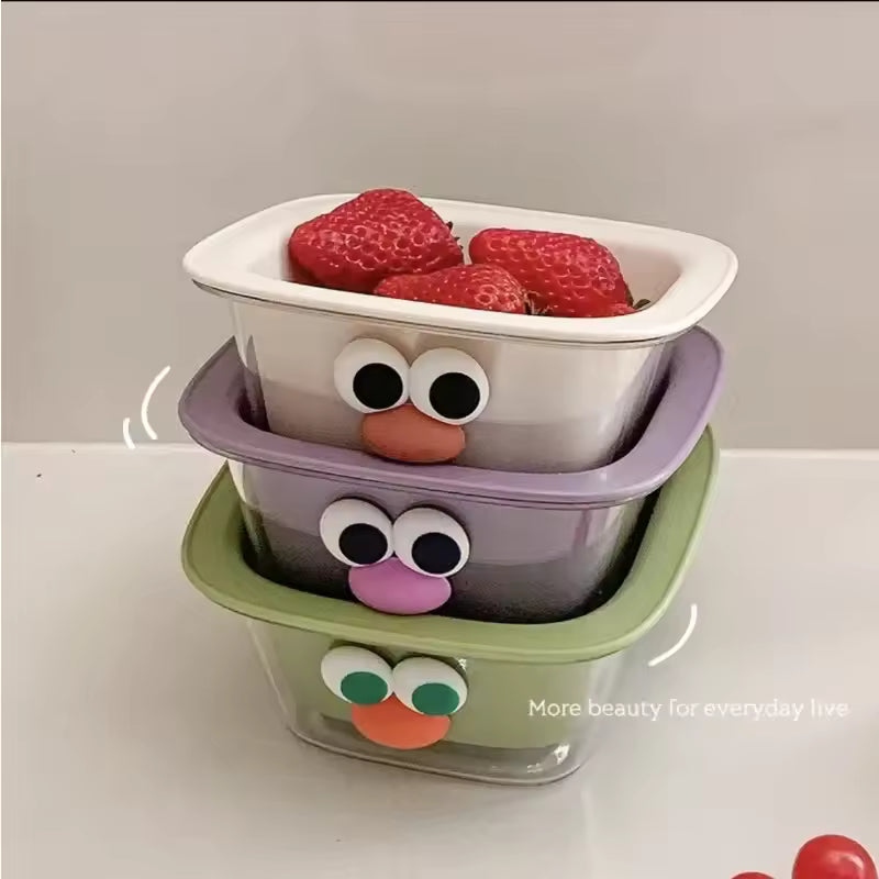 Stacked cute fruit drain basket set with colorful eyes and nose designs holding fresh strawberries