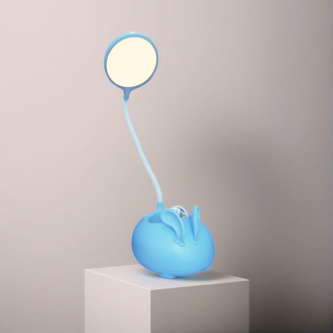 Blue cute rabbit desk lamp with flexible neck and round light sitting on white pedestal