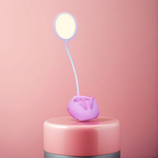Cute rabbit desk lamp in soft pink with flexible neck and glowing circular light on top