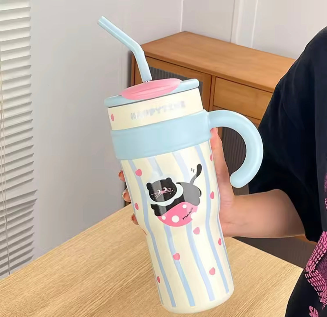 Cute stainless steel tumbler with straw featuring a cat design and pastel blue handle