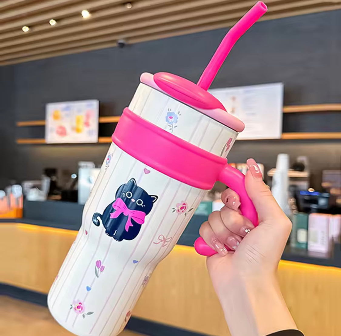 Cute stainless steel tumbler with straw featuring a black cat design and pink handle