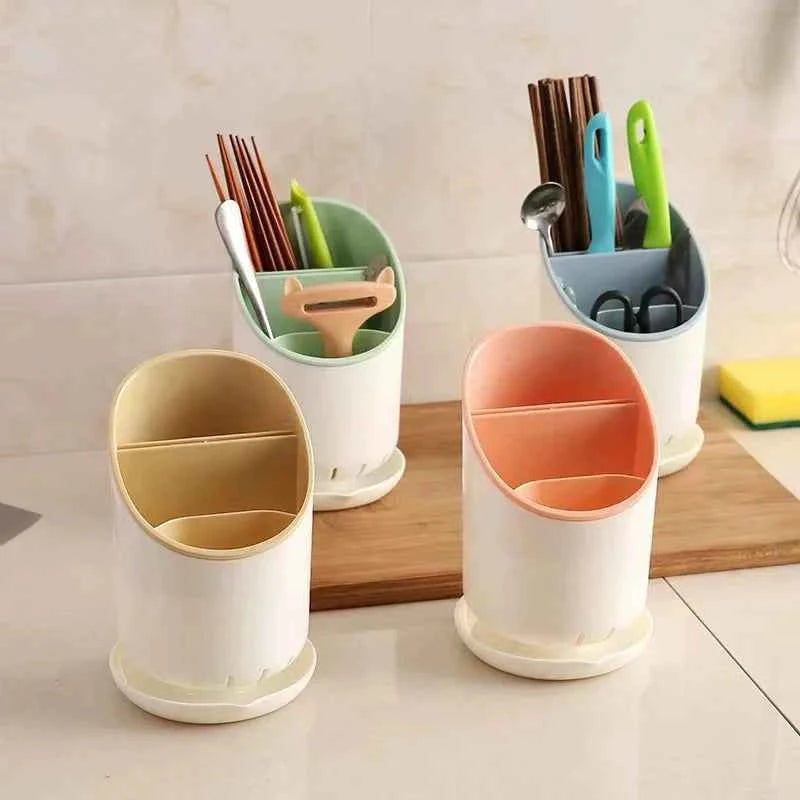 Colorful cutlery holder drying rack with sections for utensils in a kitchen setting