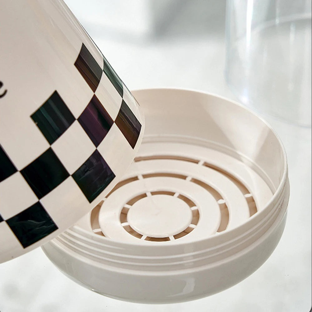 Close-up of Clarify.pk kitchen utensil holder with lid showing the vented inner structure for drainage