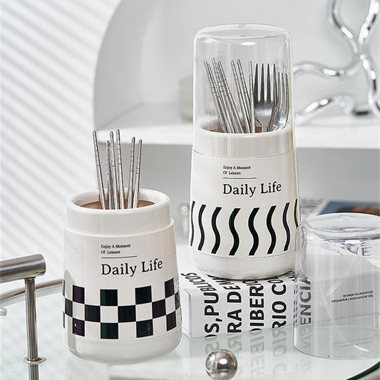 Daily Life kitchen utensil holder with lid in white with black checkered and wave patterns holding cutlery